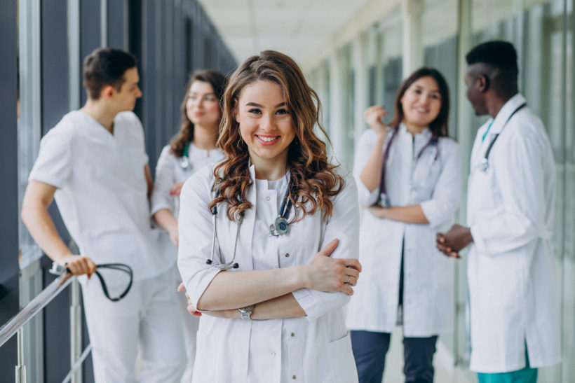 young-female-doctor-posing-in-the-corridor-of-the-hospital